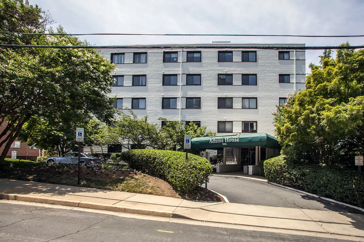 Building exterior photo of Adams House condominium on Langston Blvd in Arlington, VA.