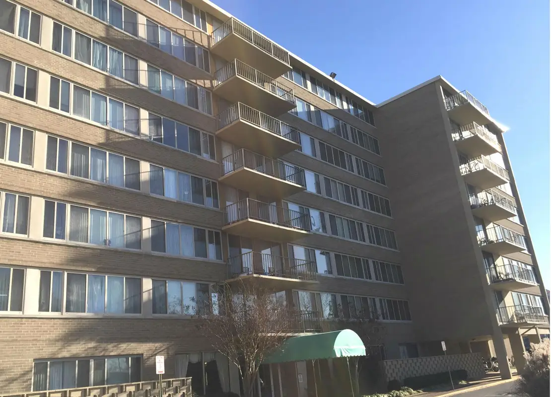 Building exterior photo of The Columbia condo building on Columbia Pike in Arlington, VA.