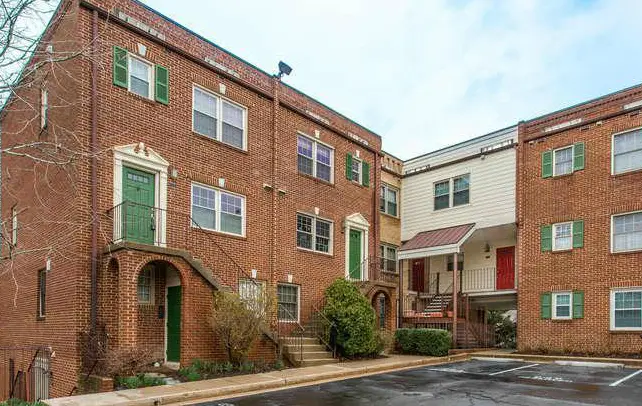 Building exterior photo of Columbia Court condominium on Columbia Pike in Arlington, VA.