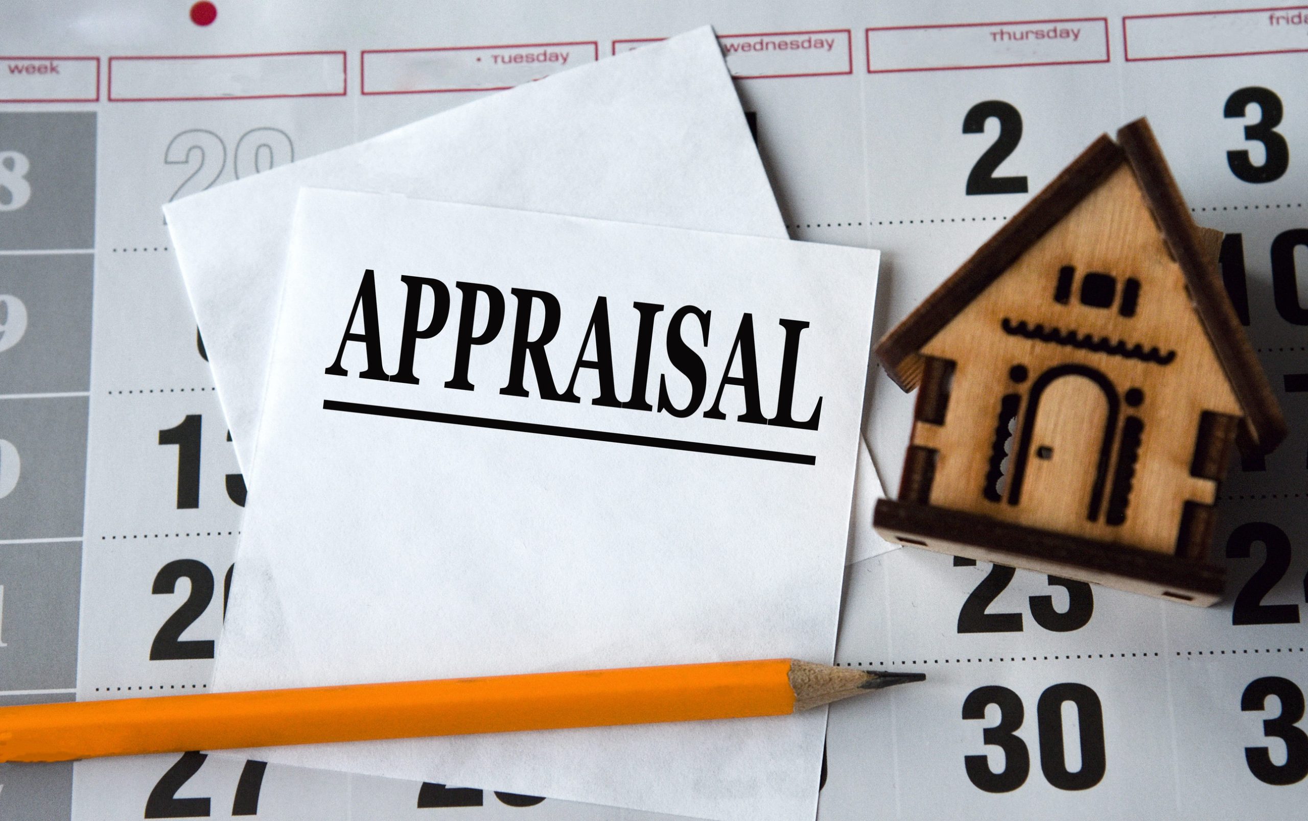 Appraiser reviewing a digital, data-driven appraisal report in an Arlington condo ahead of the November 2026 UAD 3.6 change